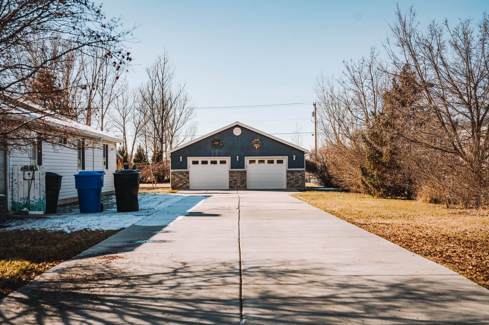 A clean driveway leading to a garage
